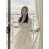 Flowy organza mini dress with long puff sleeves and ruched waist detail